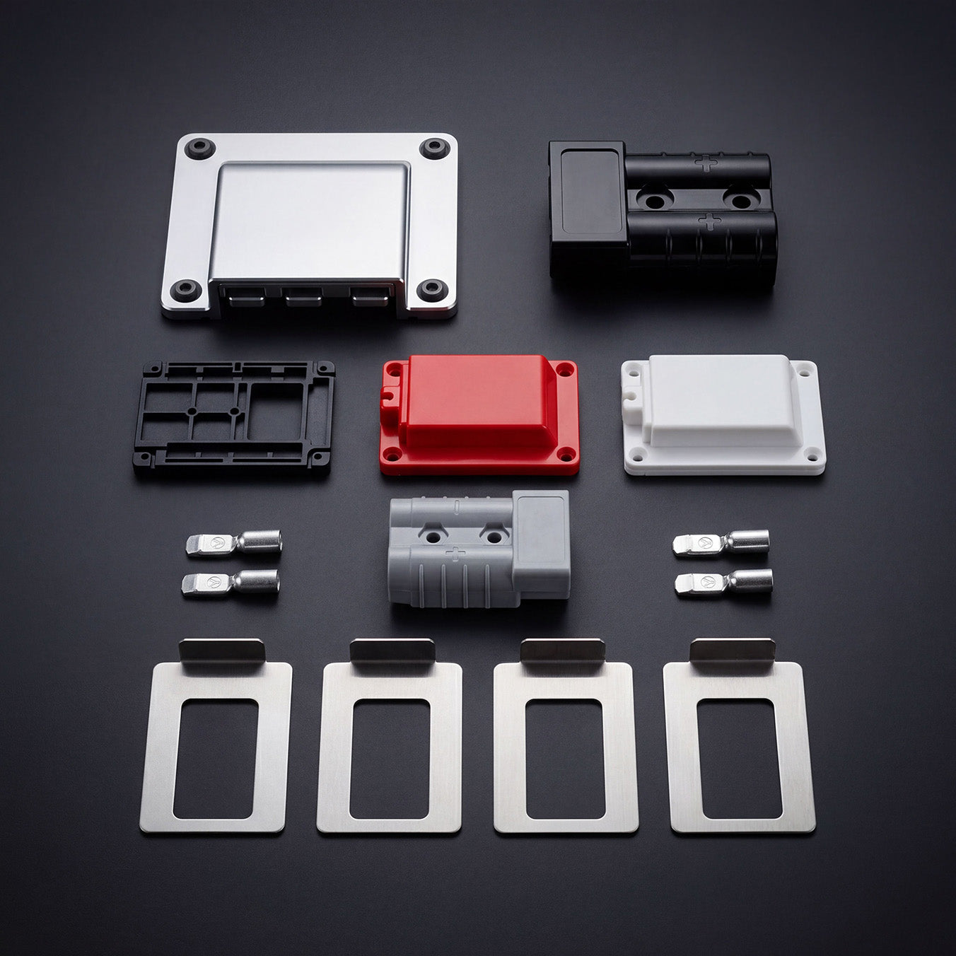 Range of PowerRoo Anderson plug covers, mounts, connector and stainless shim kit on a dark background